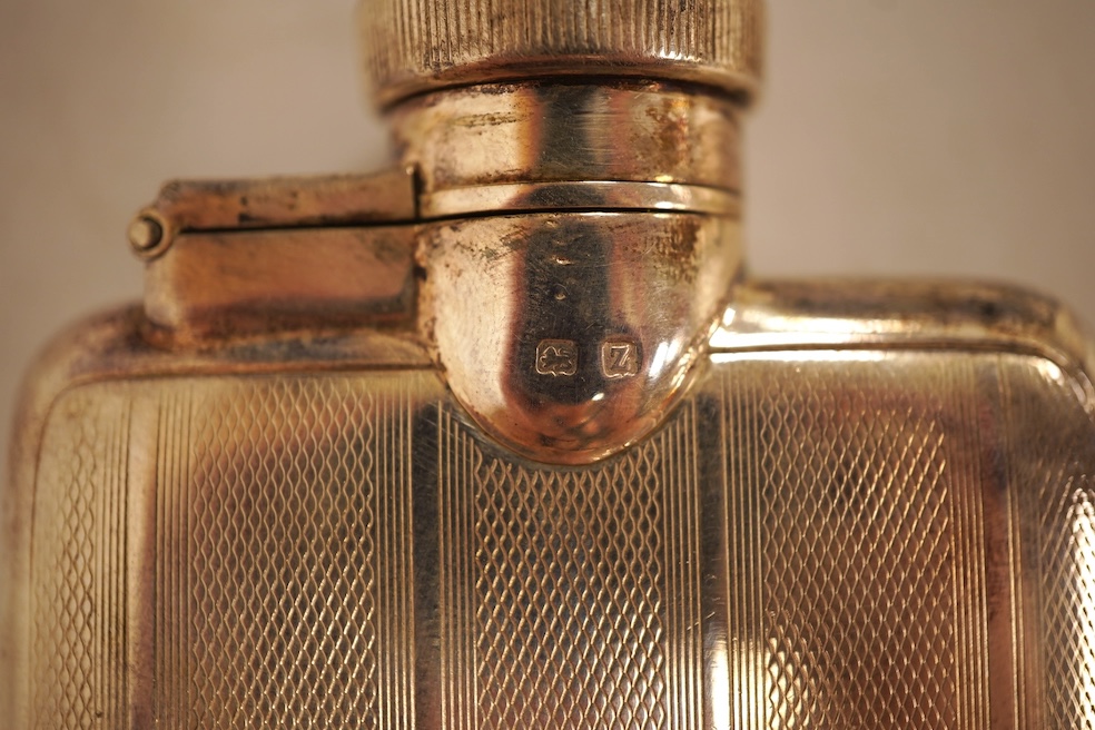 A George V engine turned silver hip flask, William Neale Ltd, Birmingham, 1924, 92mm, 89 grams.